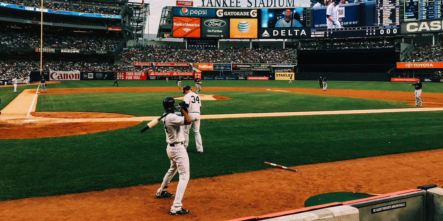 baseball players warming up on a baseball field in yankee stadium, innovative portfolios market outlook