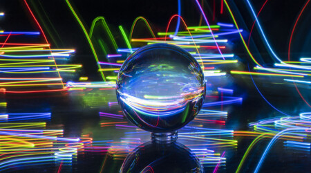 crystal ball with black background and neon lights, innovative portfolios perspectives
