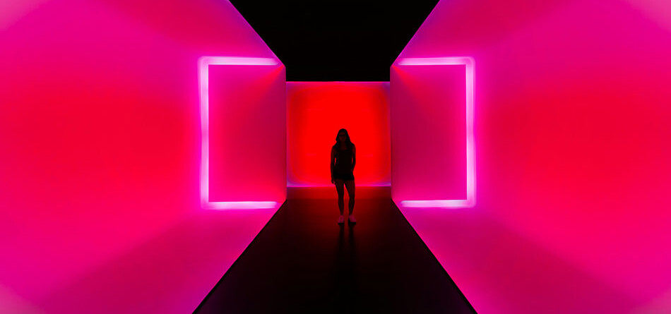 dark silhouette of a person standing at the end of a tunnel with neon pink walls, innovative portfolios perspectives