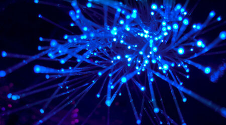 close up of blue strands of lights on black background, innovative portfolios perspectives